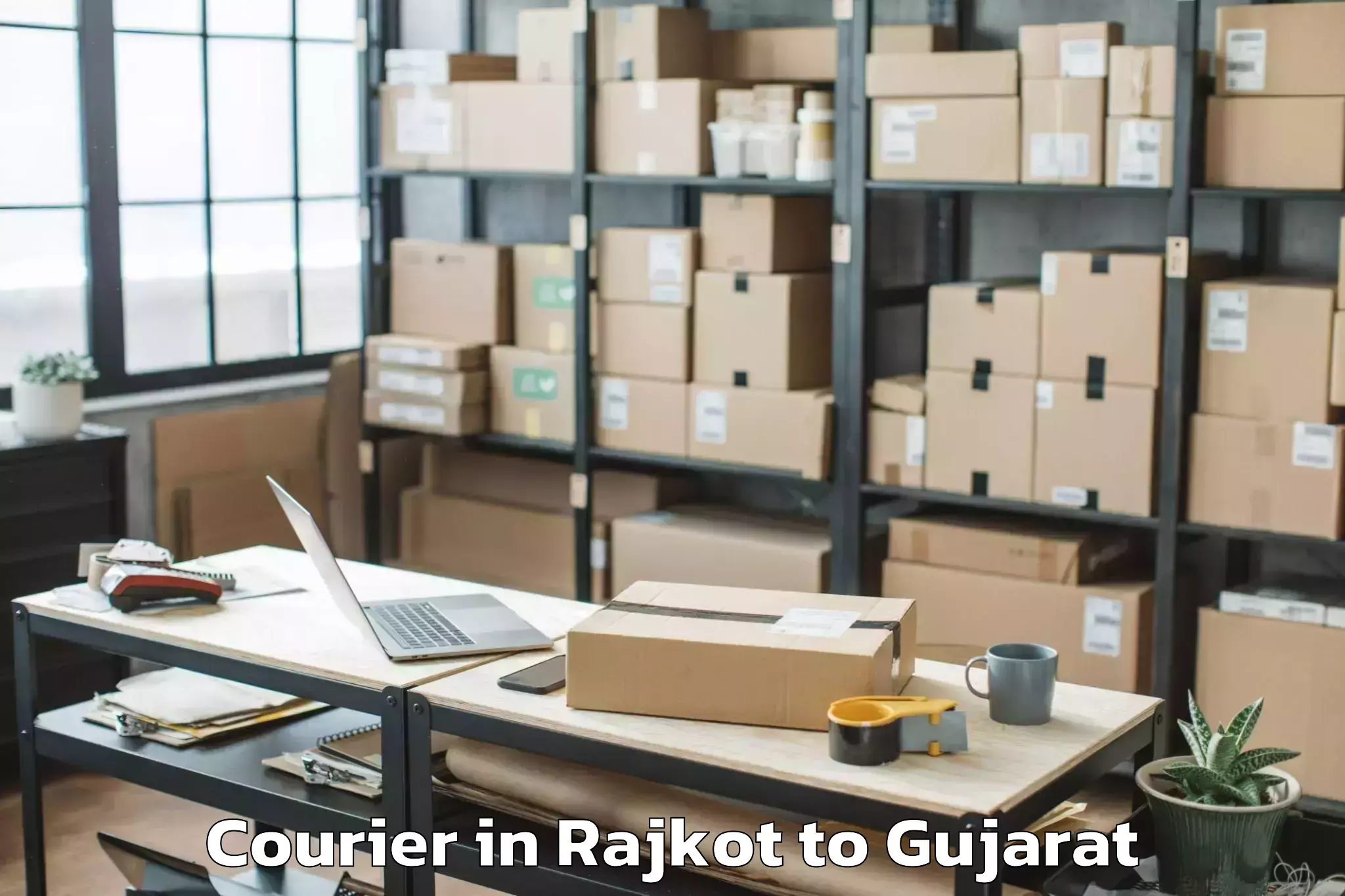 Reliable Rajkot to Kadi Sarva Vishwavidyalaya Gan Courier